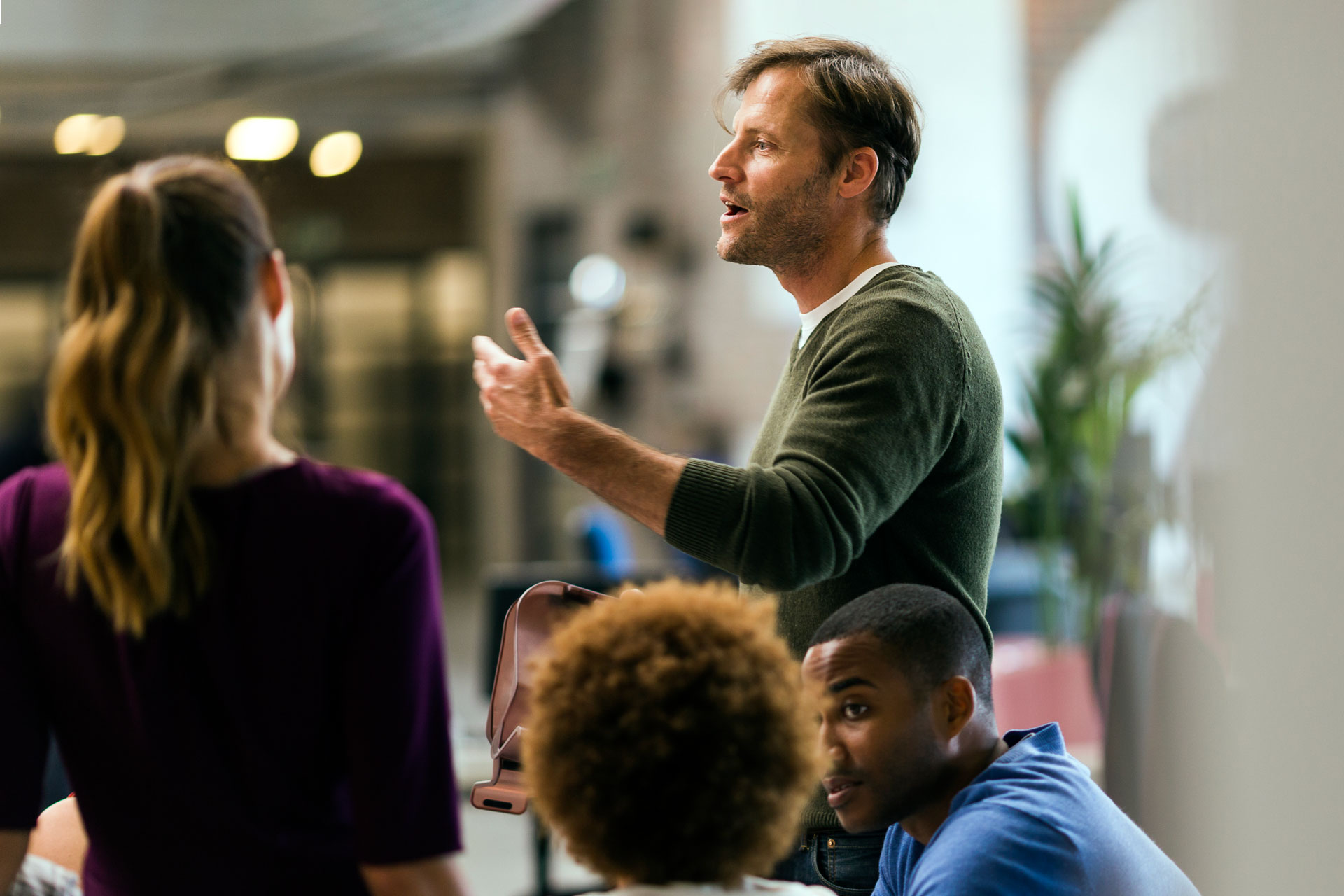Man speaking to group gathering