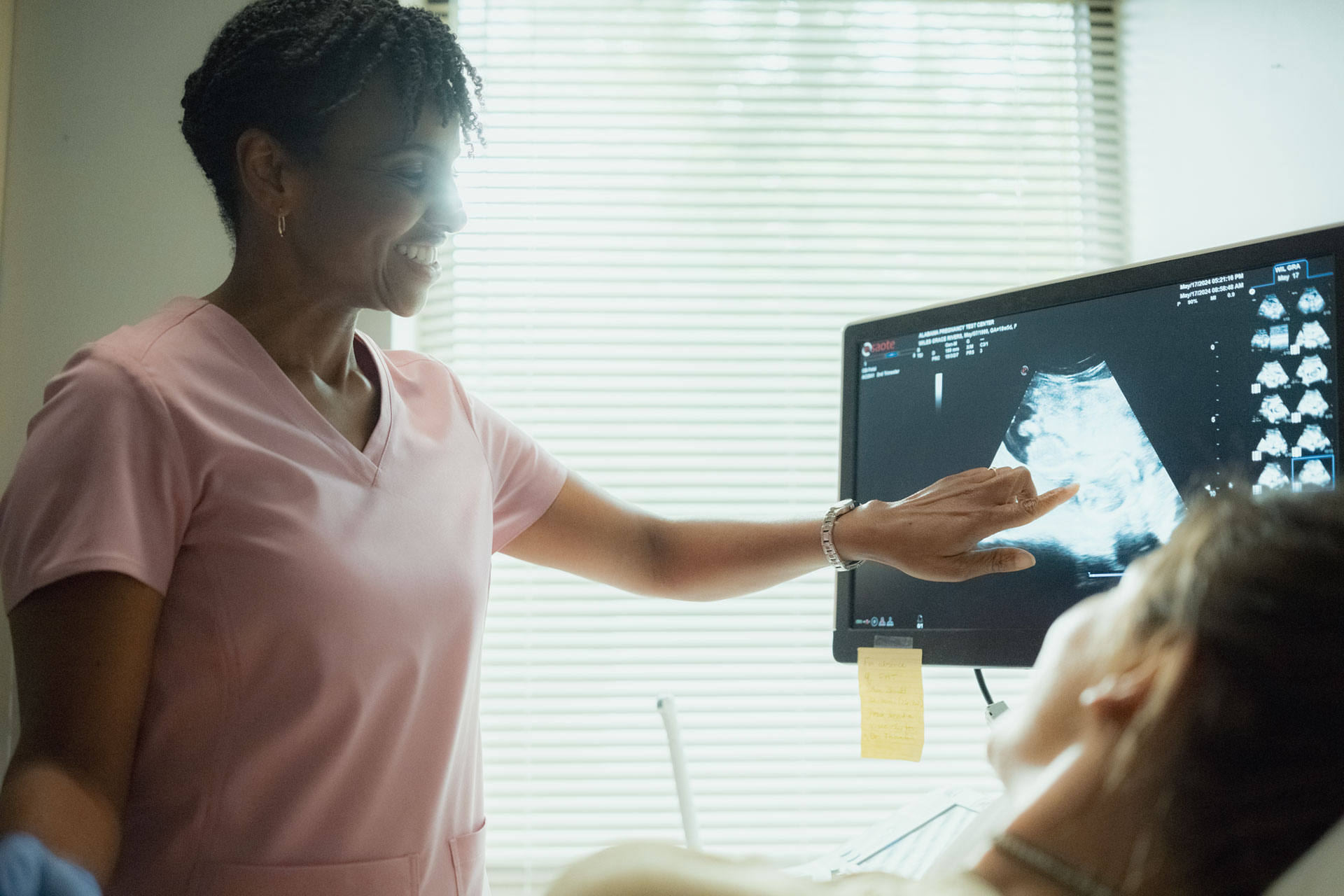Medical professional reviewing a scan with a young woman